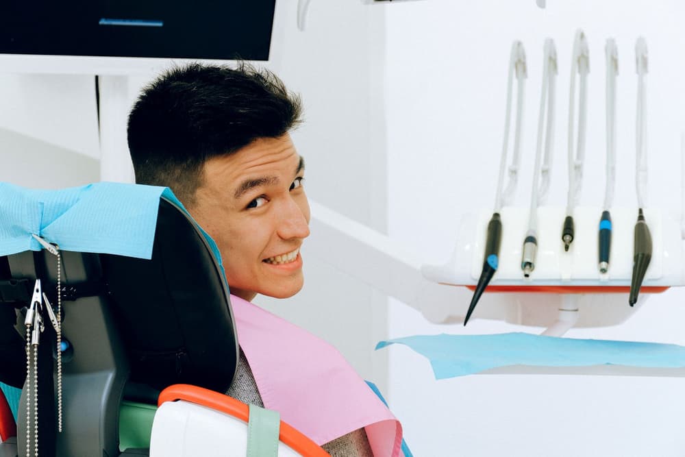 A patient laughing in the dental chair